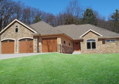 Exterior of house with multiple garage doors