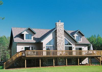 House with large deck and chimney