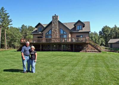 Exterior of a house with large lawn and homeowners