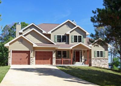 Exterior of house with multiple garage doors